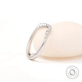 Side angled view highlighting matte white gold finish and diamond curve