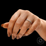 Curved half eternity diamond band worn on finger showing contour fit