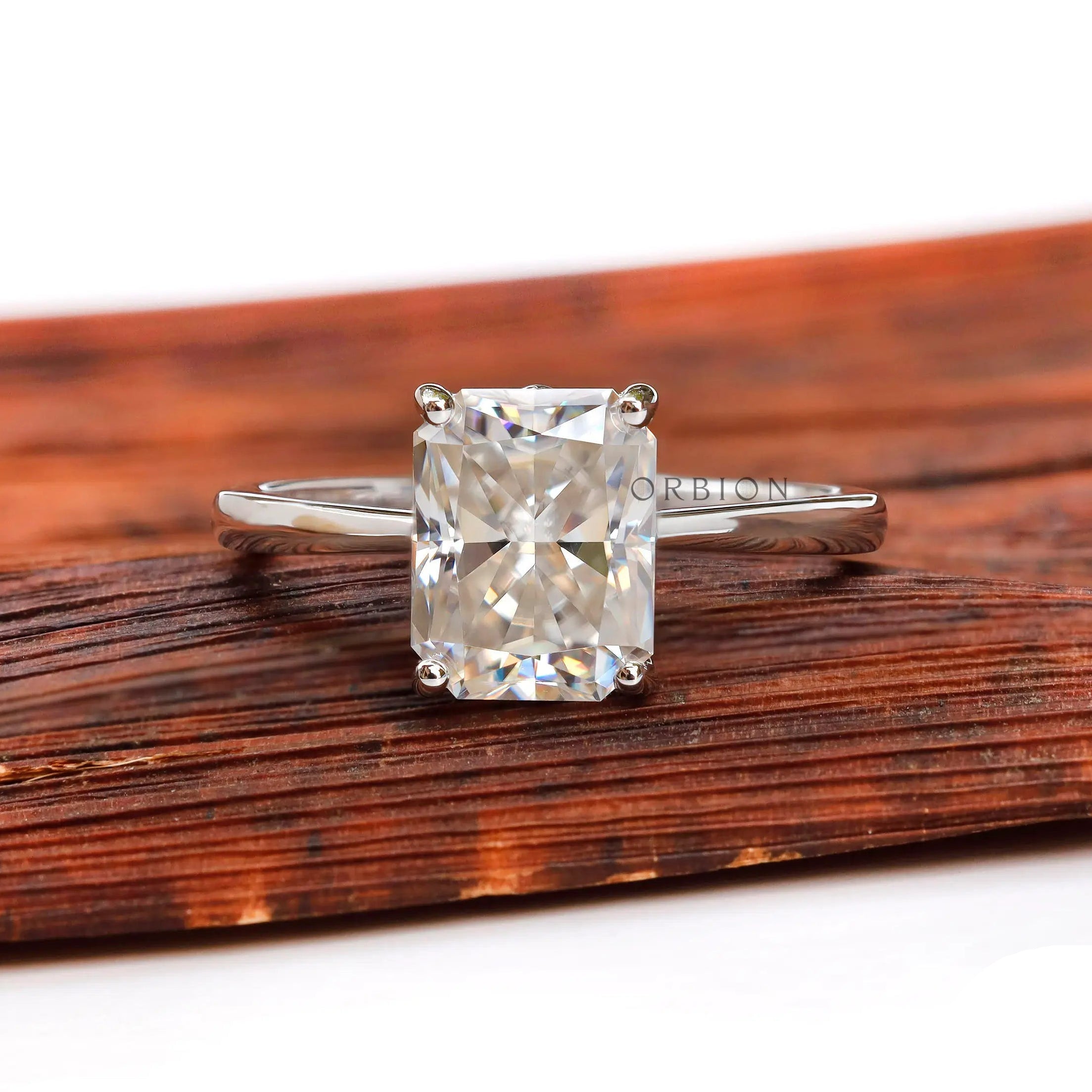 Radiant cut solitaire engagement ring in 10K white gold front view