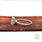 Side profile of radiant cut moissanite solitaire ring with tapered band