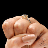 Close up of round moissanite prong setting detail