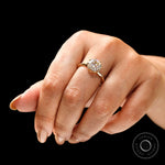 Elegant round moissanite engagement ring worn on hand