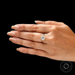 Timeless round moissanite solitaire engagement ring worn on hand