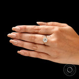 Timeless round moissanite solitaire engagement ring worn on hand