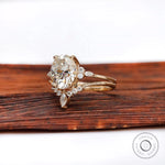 Oval moissanite cluster bridal ring set in 14K yellow gold