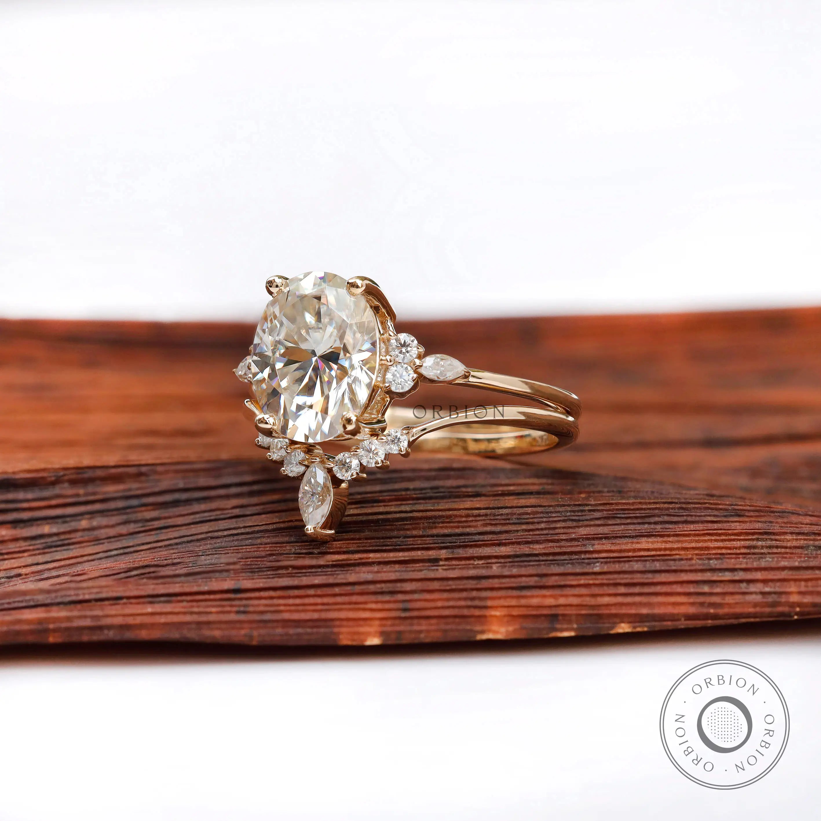 Oval moissanite cluster bridal ring set in 14K yellow gold