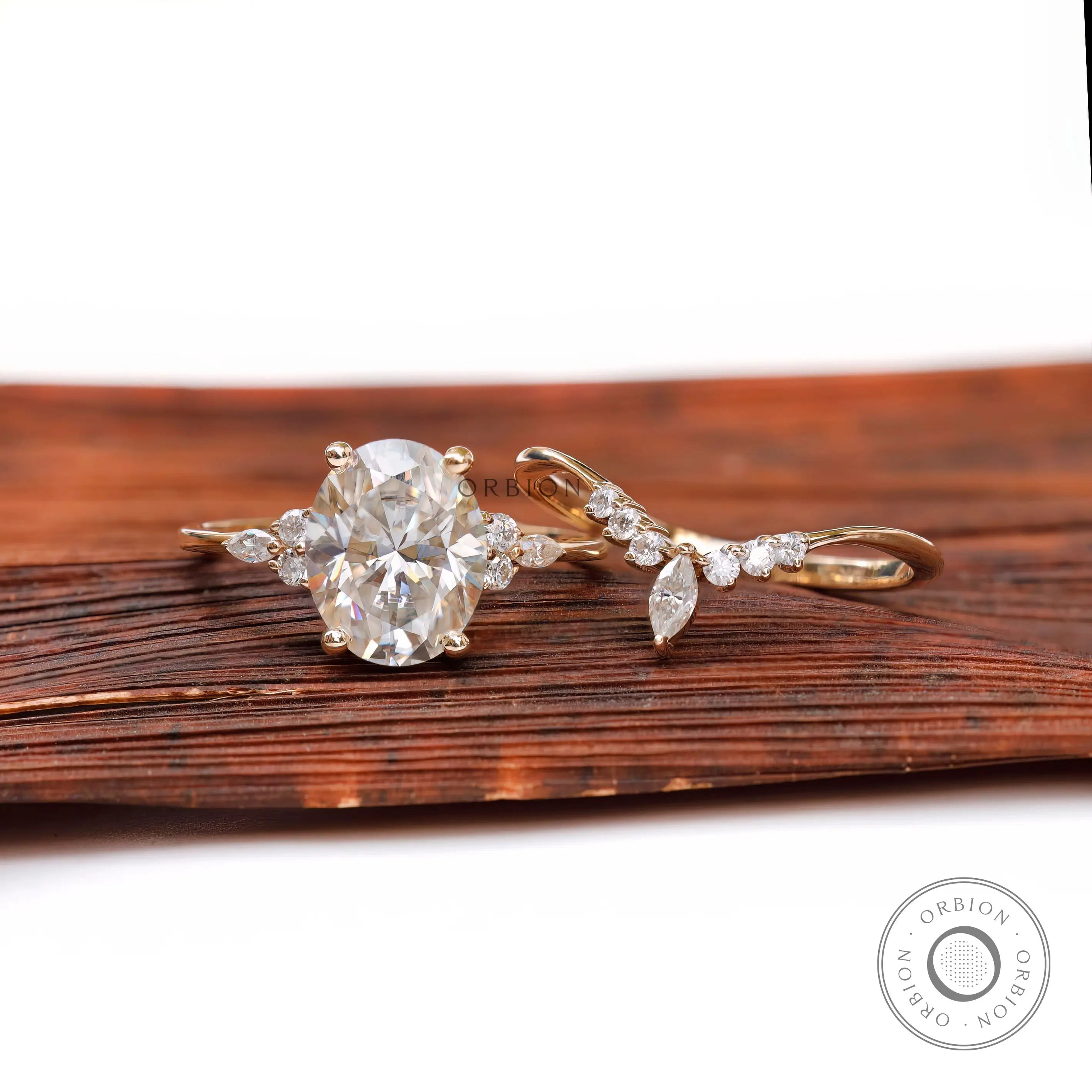 Floral cluster moissanite engagement ring with matching band