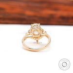 Close-up of oval moissanite cluster setting with marquise accents