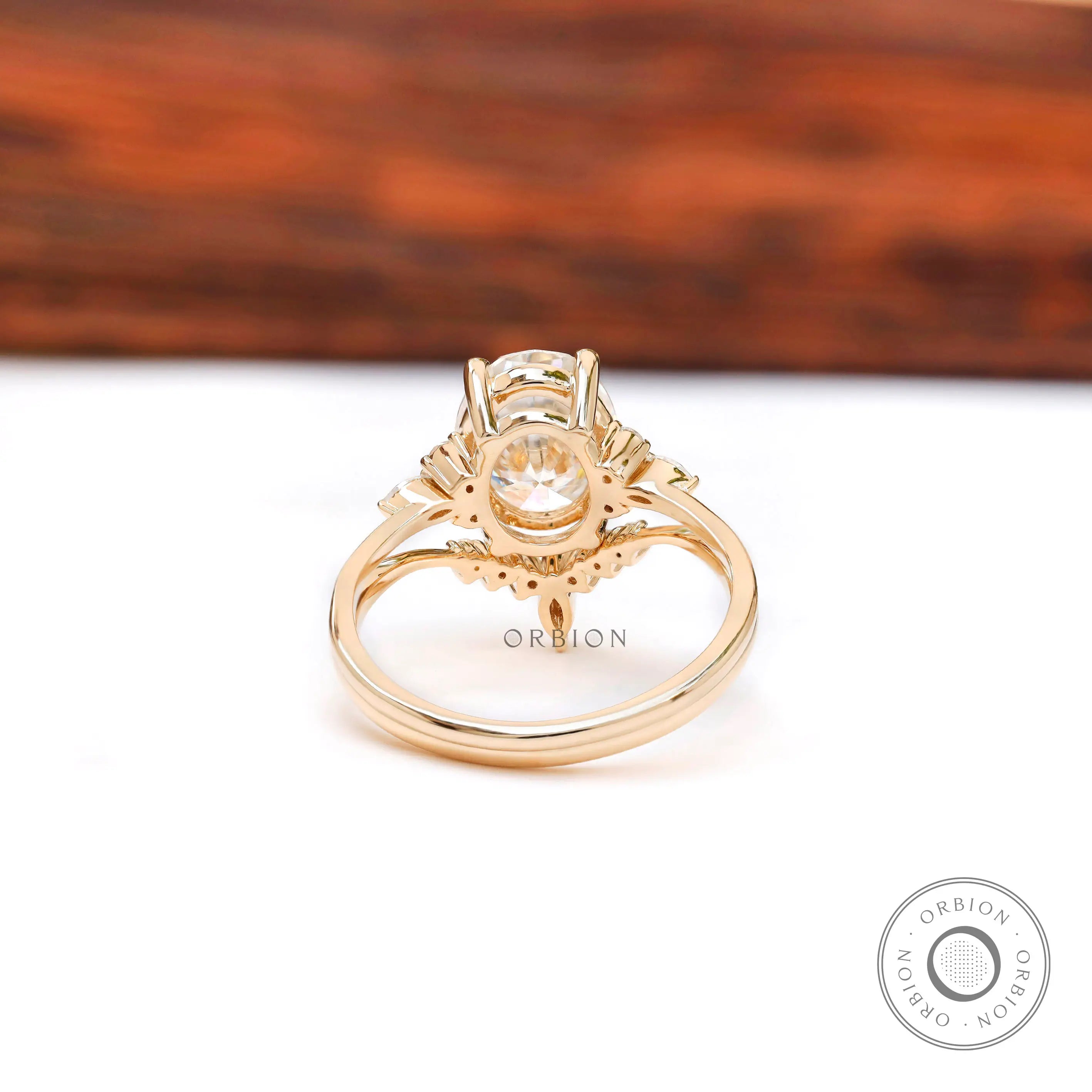 Close-up of oval moissanite cluster setting with marquise accents