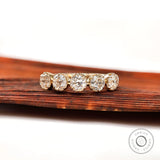 Front view of five stone round moissanite band