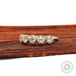 Angled view highlighting five round moissanite stones