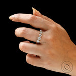 Lifestyle view of five stone yellow gold band