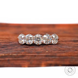 Front view of five elongated cushion moissanite half eternity band