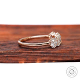 Side profile of elongated cushion moissanites in rose gold band