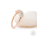 Angled view of elongated cushion moissanites half eternity ring