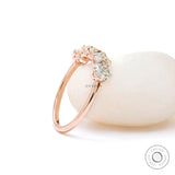 Angled view of elongated cushion moissanites half eternity ring