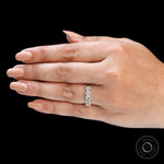 Straight hand view of elongated cushion moissanite half eternity ring