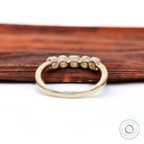 Back view highlighting smooth gallery and polished yellow gold shank.