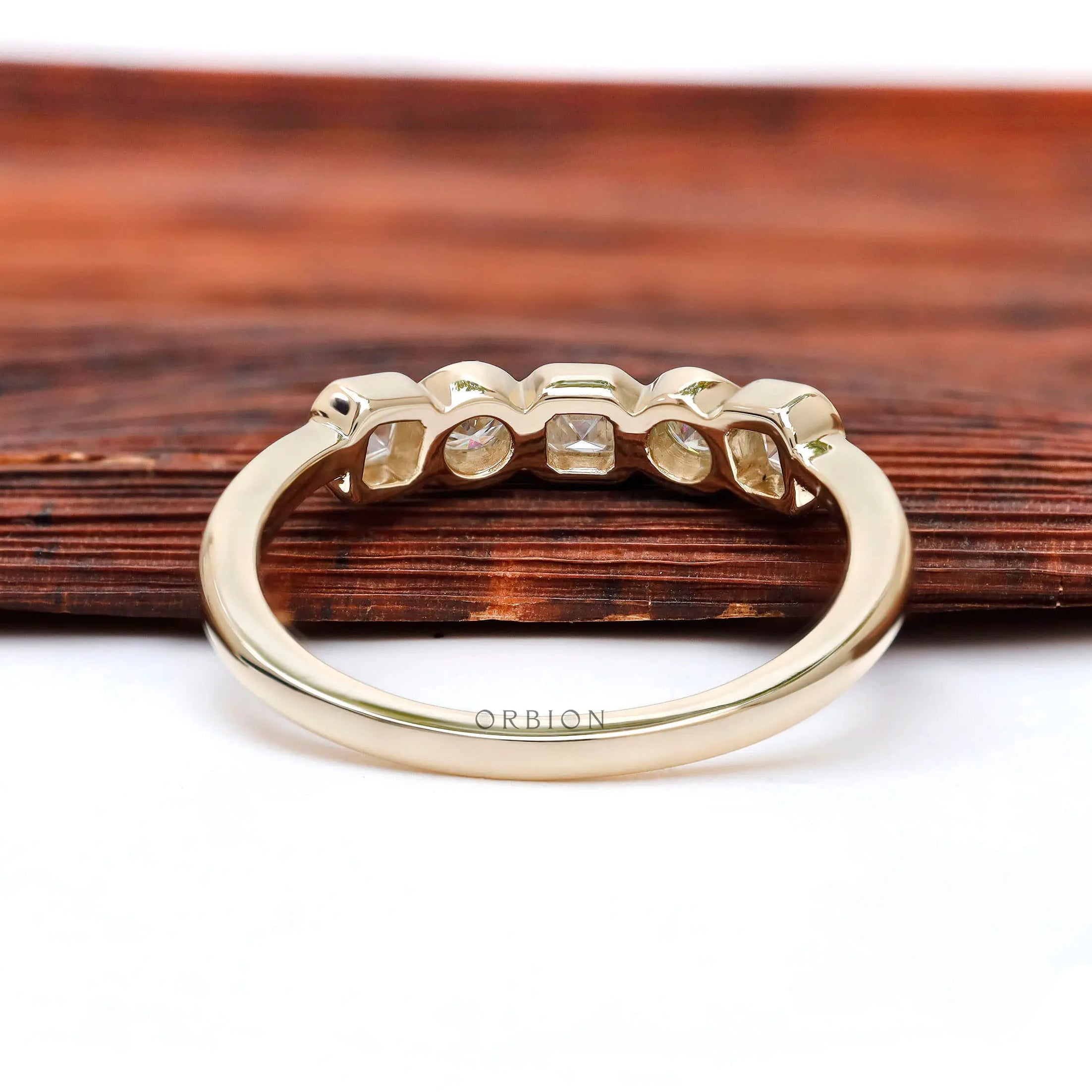 Back view highlighting smooth gallery and polished yellow gold shank.
