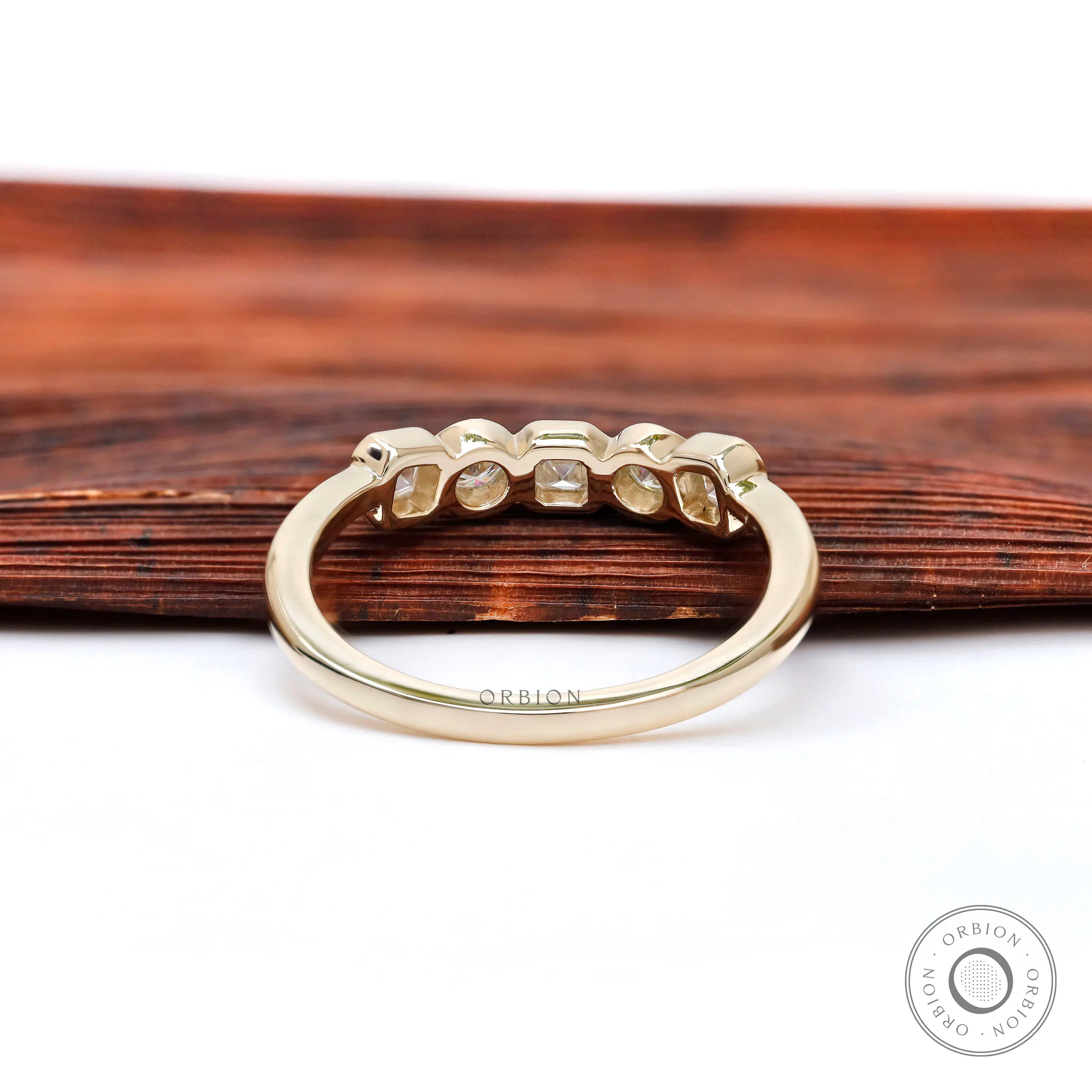 Back view highlighting smooth gallery and polished yellow gold shank.