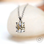 Elongated cushion Old Mine cut moissanite pendant in white gold close-up