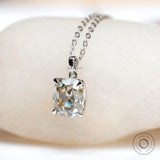 Cushion cut solitaire pendant with four prong setting on chain