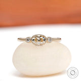 Front view of elongated cushion moissanite ring with round side stones