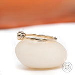 Side profile of three stone moissanite engagement ring in yellow gold