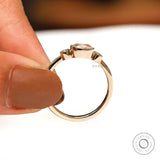 Minimalist three stone moissanite engagement ring in yellow gold