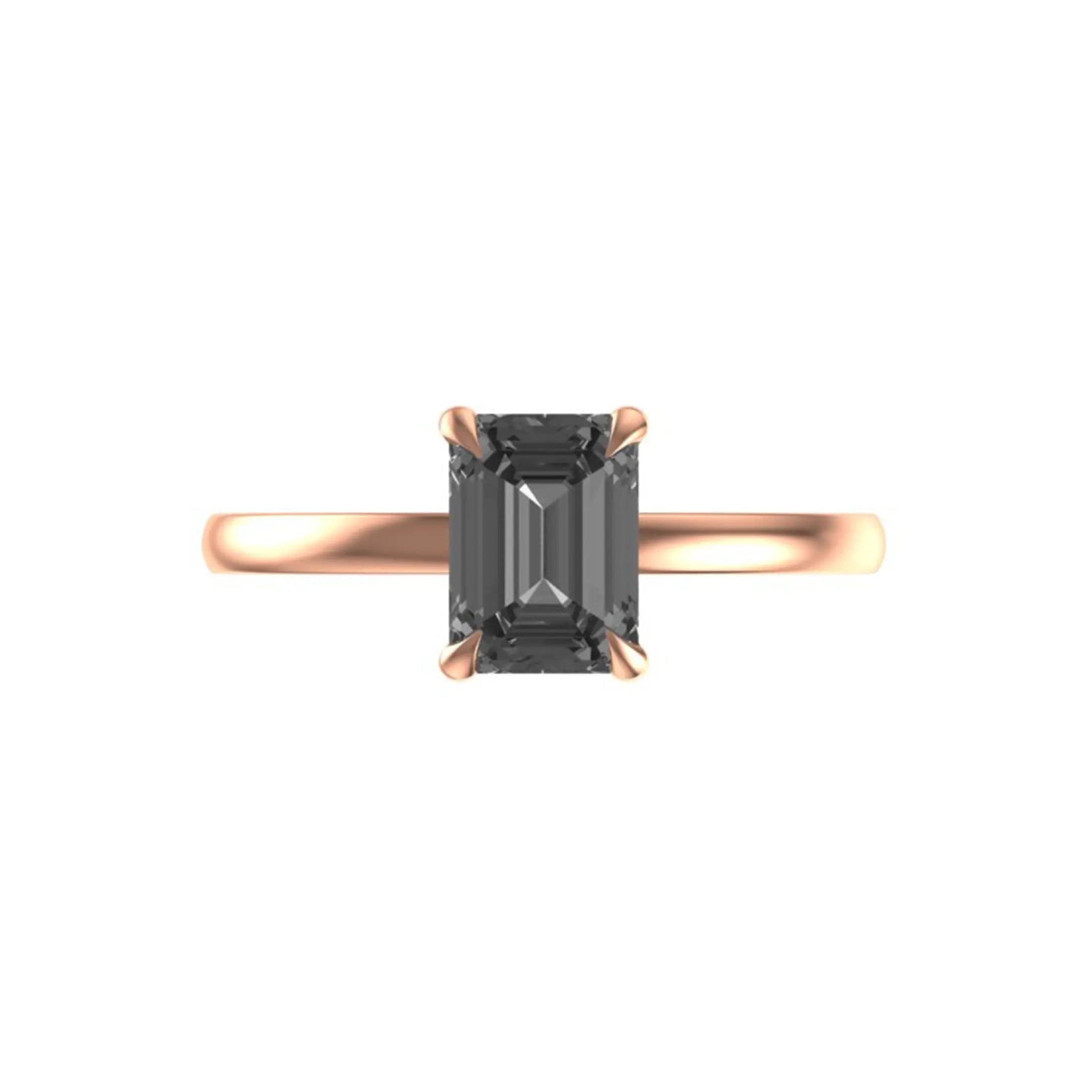 Front view of emerald cut grey moissanite solitaire ring in rose gold.