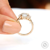 Side profile view of elevated basket setting held between fingers