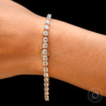 Wrist closeup highlighting box clasp on moissanite tennis bracelet