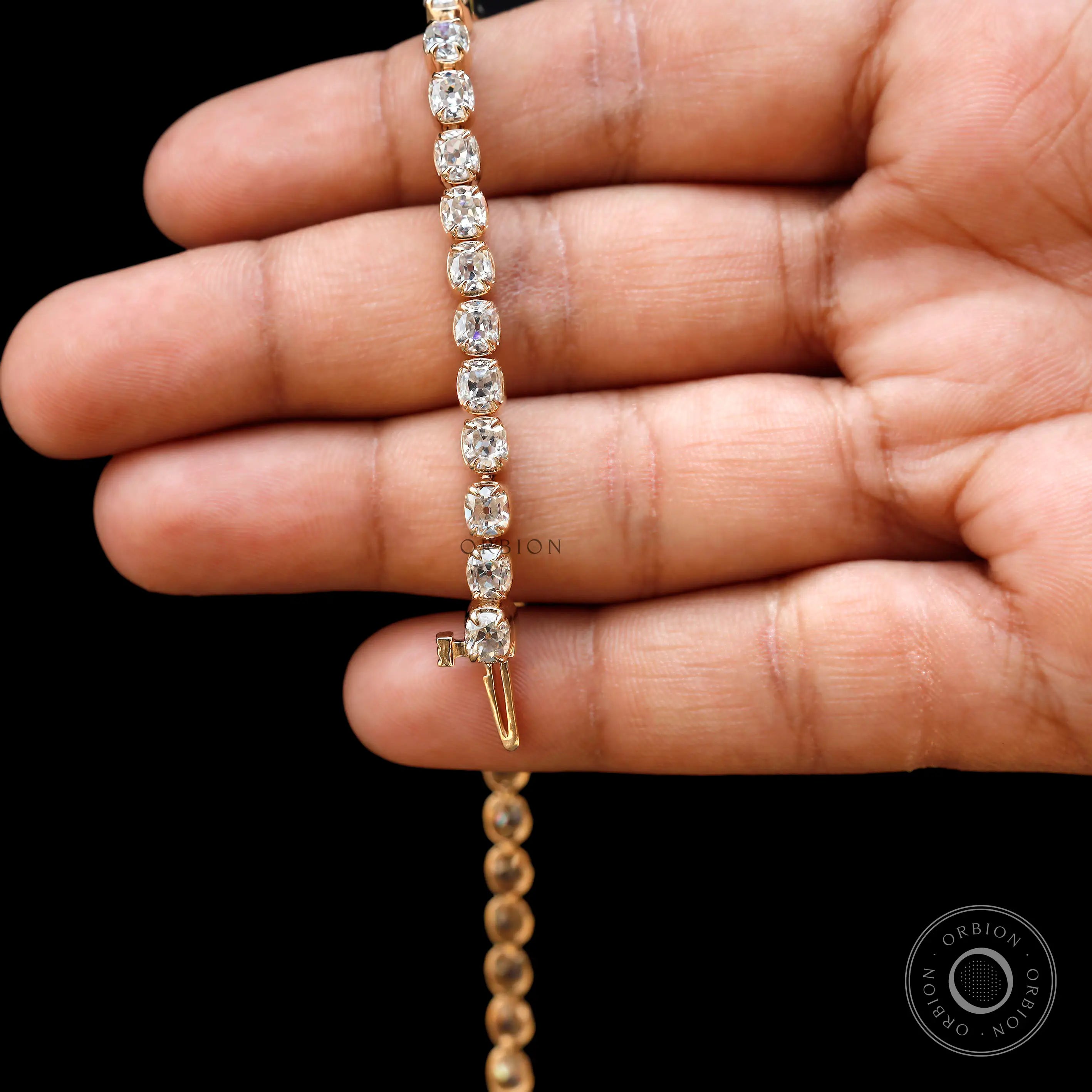 Detailed box clasp view of yellow gold tennis bracelet