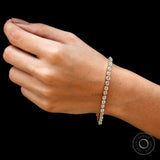Full wrist shot of dainty OMC moissanite tennis bracelet