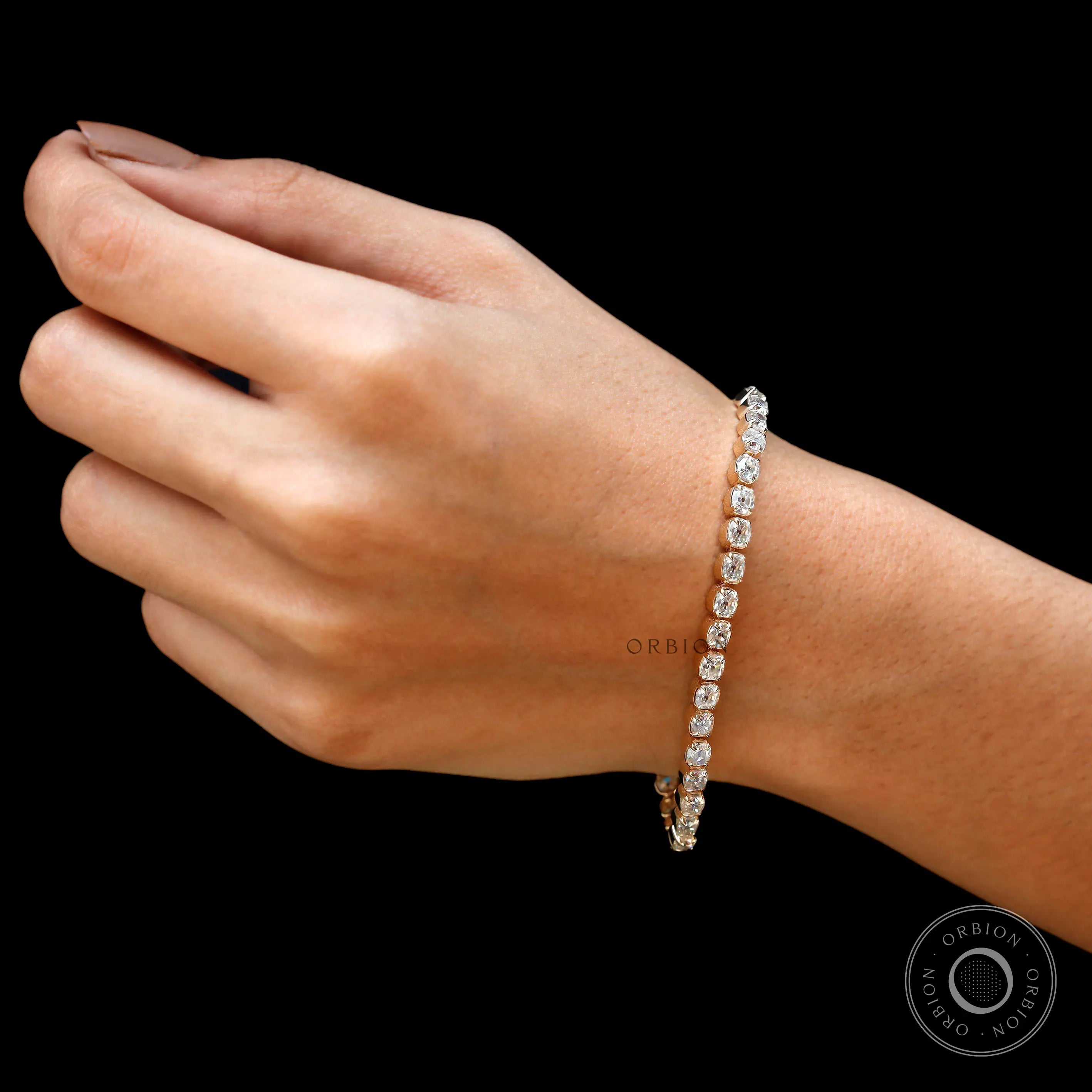 Full wrist shot of dainty OMC moissanite tennis bracelet