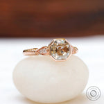 Angled view showcasing cathedral design of Octavia ring with side diamonds