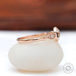 Side view showcasing cathedral design of Octavia ring with side diamonds