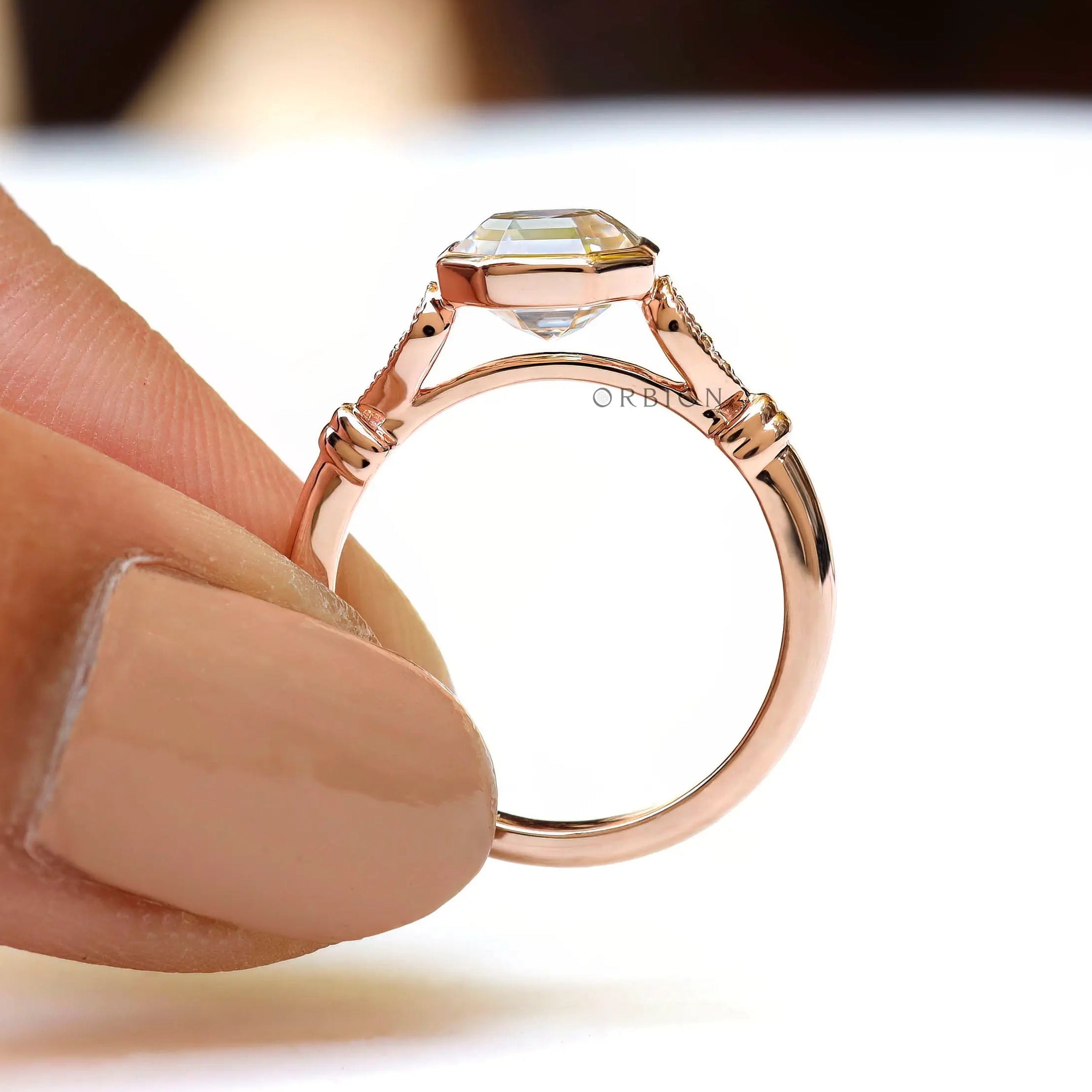 Close-up of bezel setting with Asscher cut moissanite ring