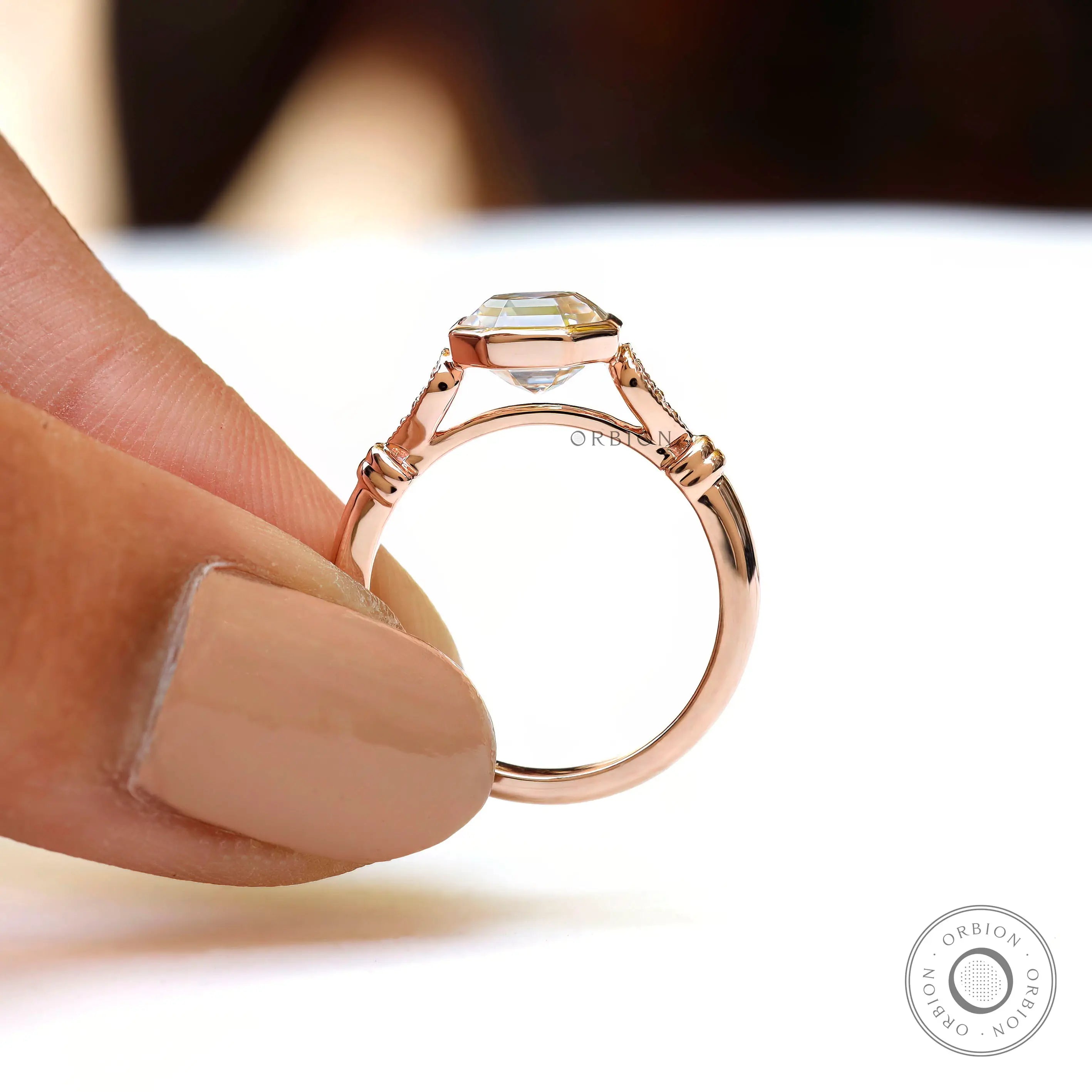 Close-up of bezel setting with Asscher cut moissanite ring