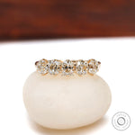 Front view of five stone old mine cut cushion moissanite band