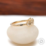 Side angle highlighting prong setting and polished yellow gold shank