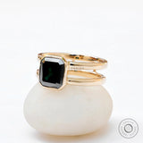 Close-up of Moissanite Solitaire Elongated Asscher ring with black green center stone