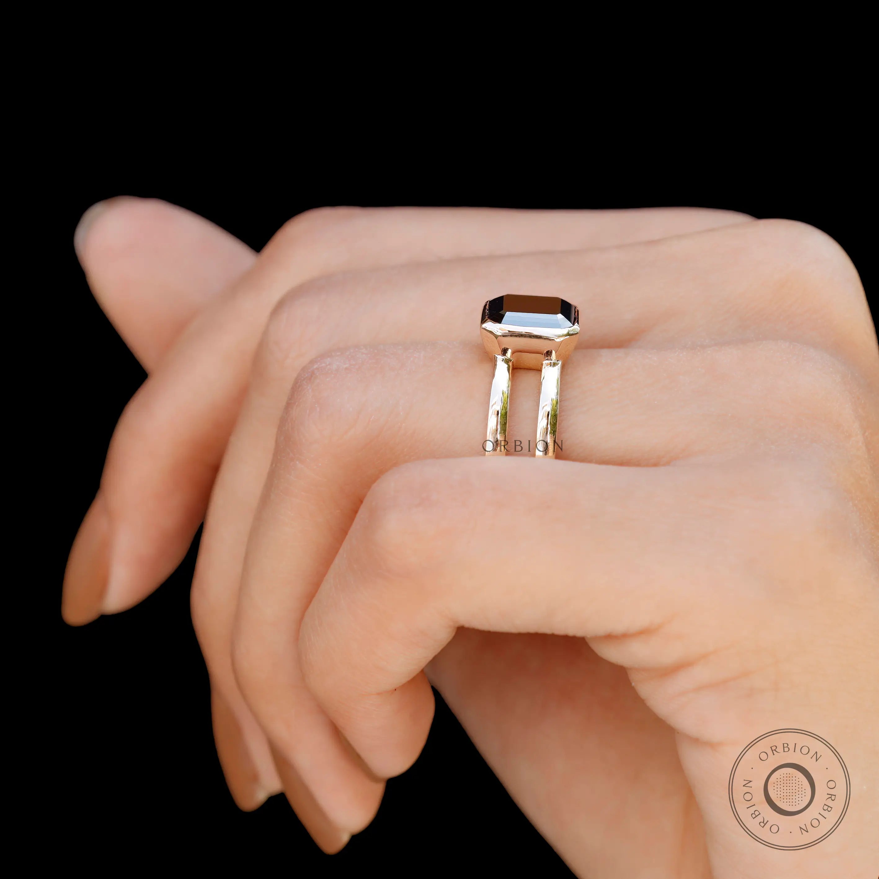 Moissanite Solitaire Elongated Asscher ring on a finger, showcasing the unique design