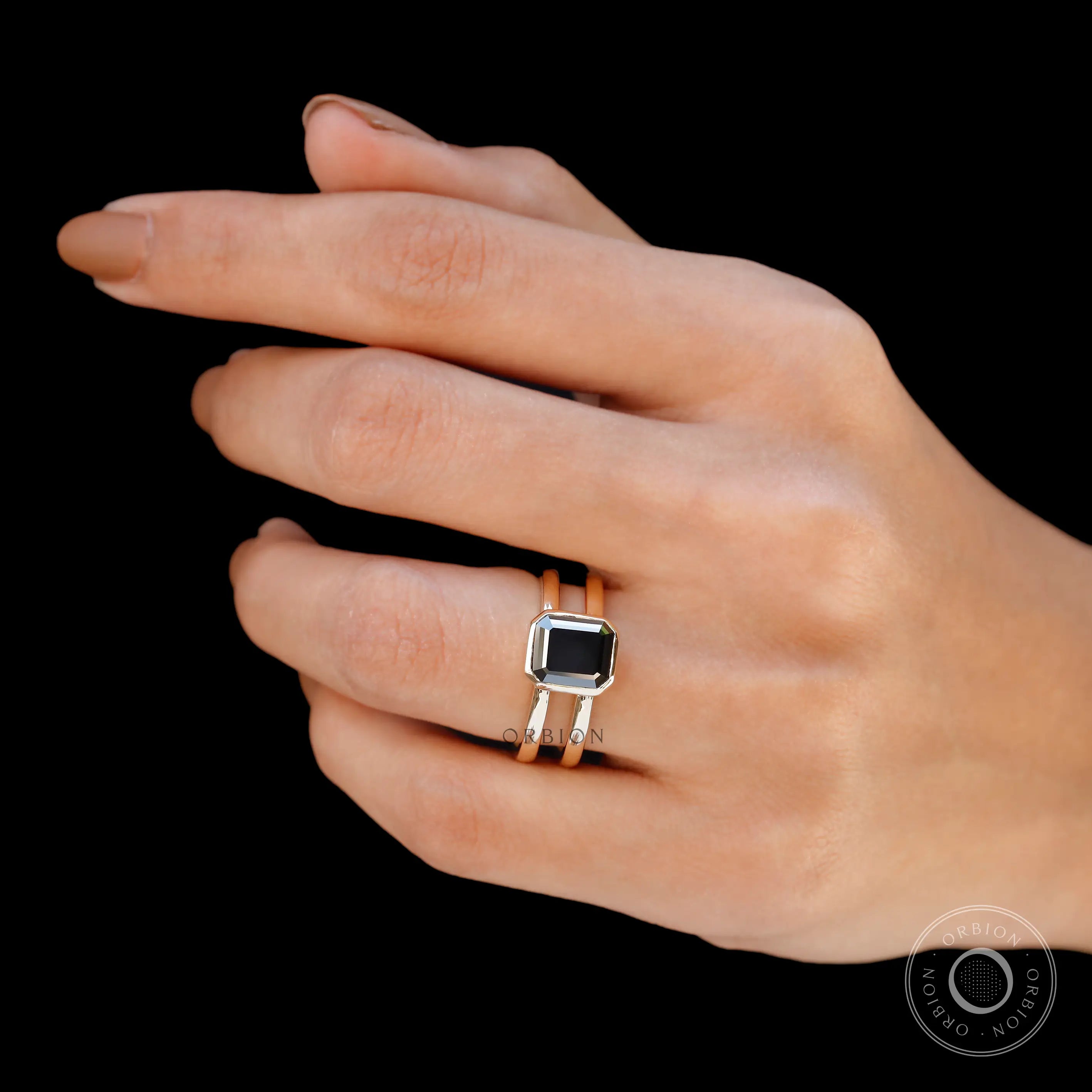 Elongated Asscher Moissanite ring with black green stone from side view