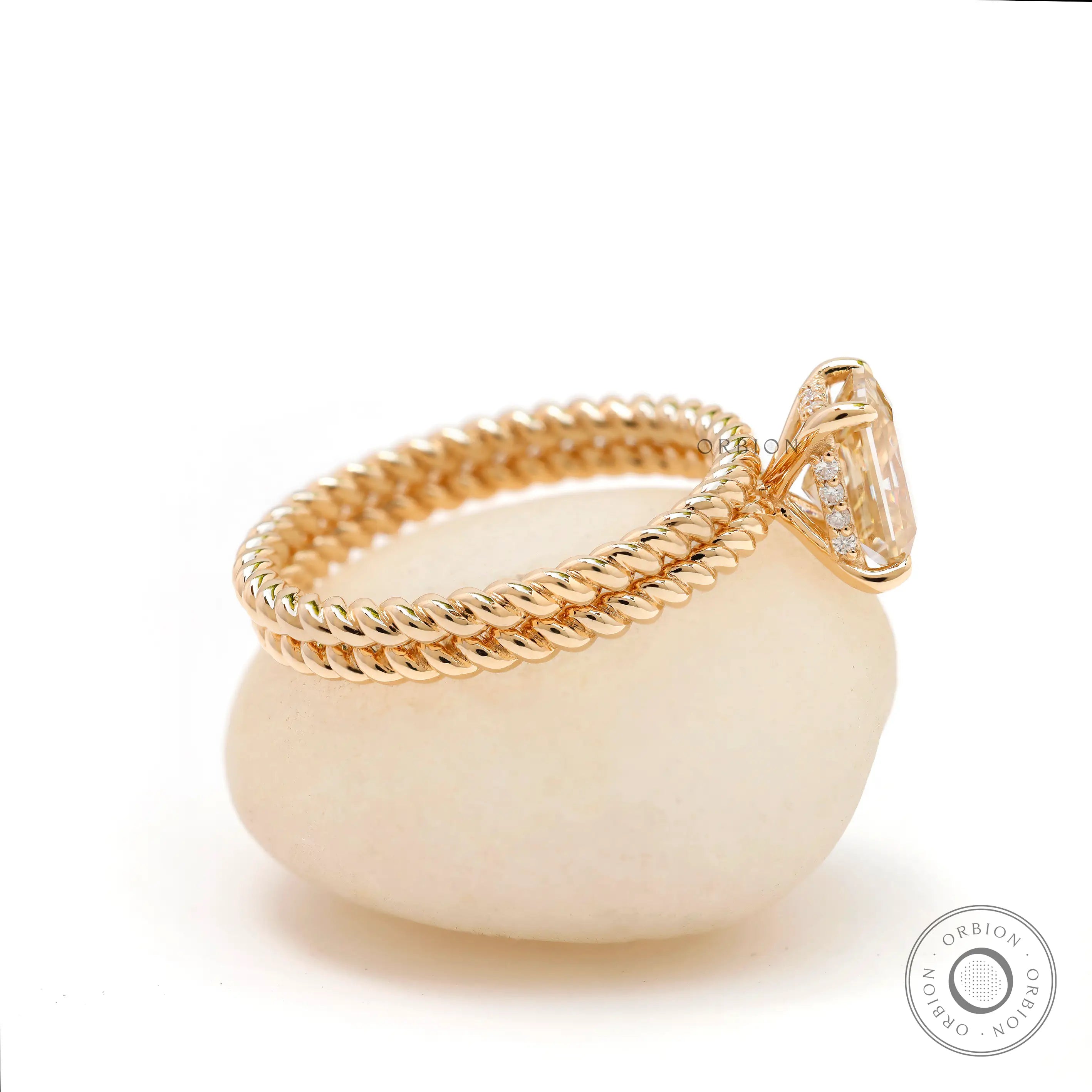 Twisted rope band ring with radiant champagne moissanite and halo
