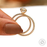 Profile shot of radiant champagne moissanite hidden halo ring