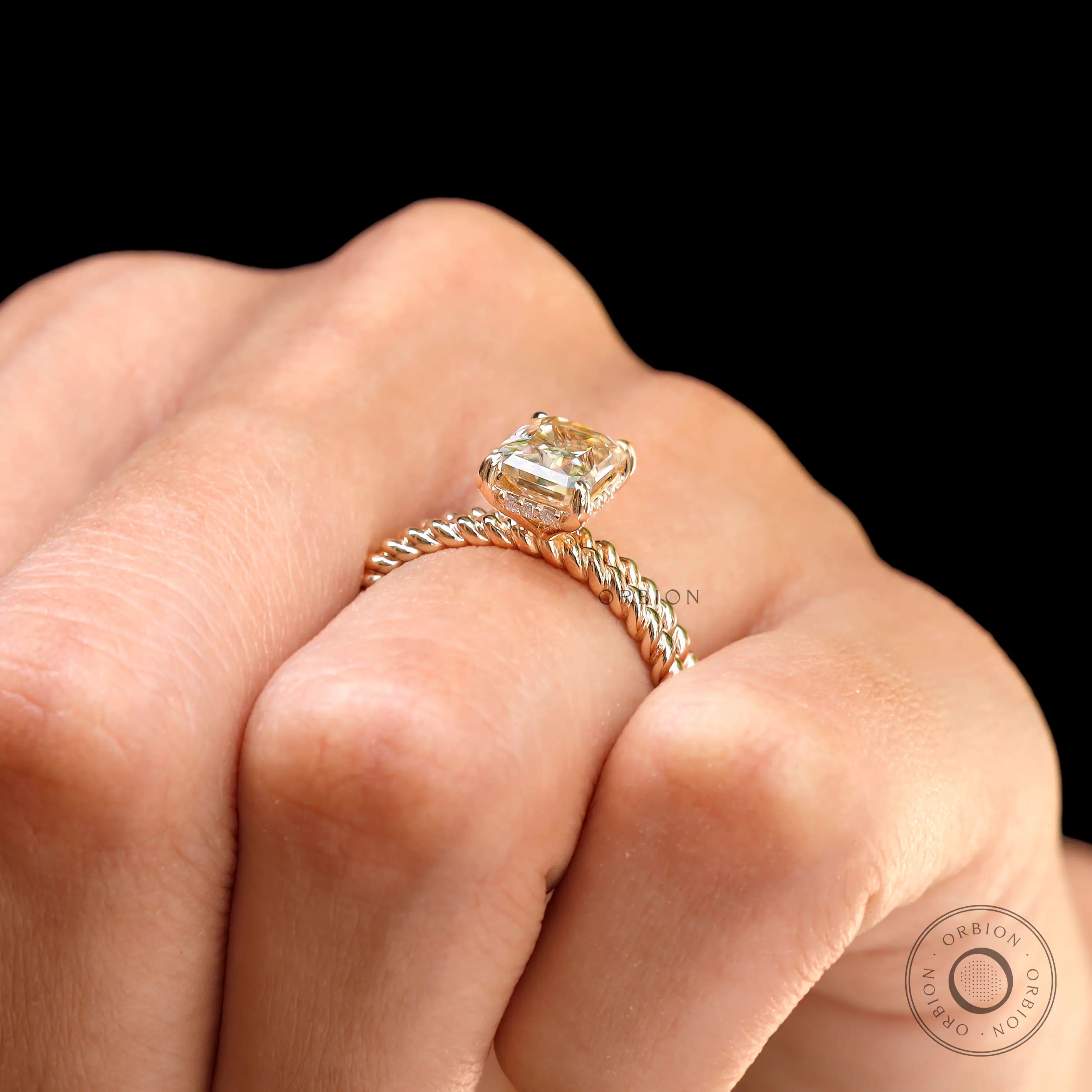 Top worn view of Radiant champagne hidden halo ring with twisted rope band