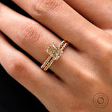 Champagne moissanite hidden halo ring with twisted rope band on hand