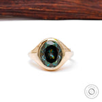Oval blue green moissanite signet ring in 10k yellow gold