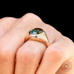 High polish yellow gold signet ring with oval moissanite